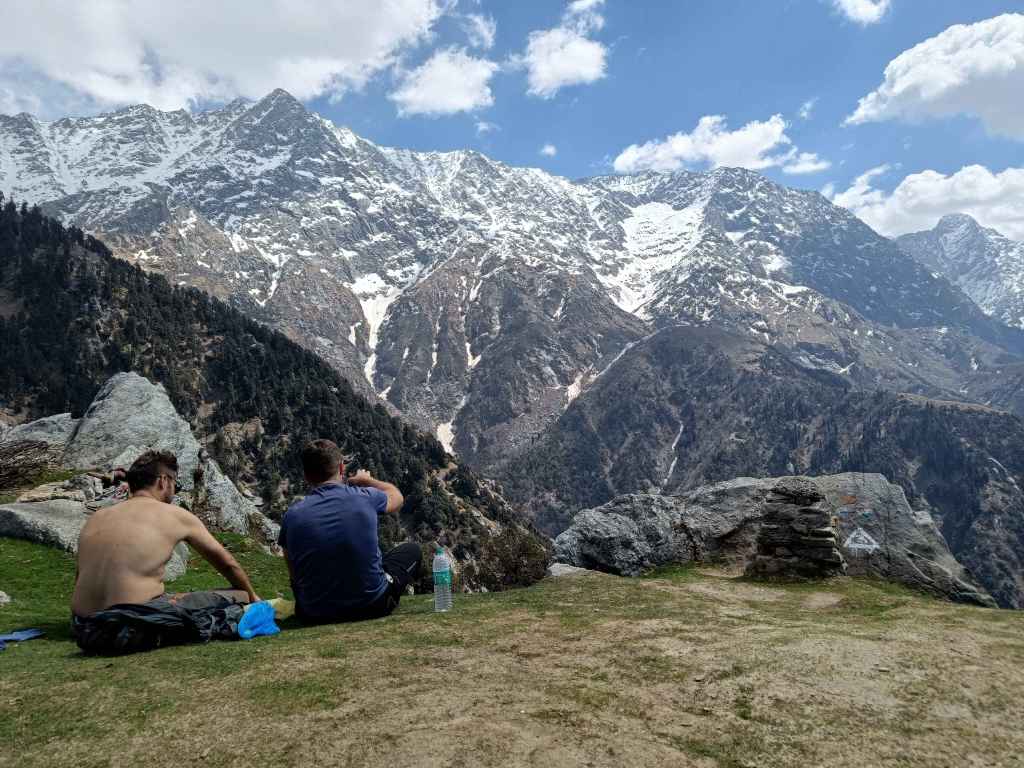 two people at the top of triund trek